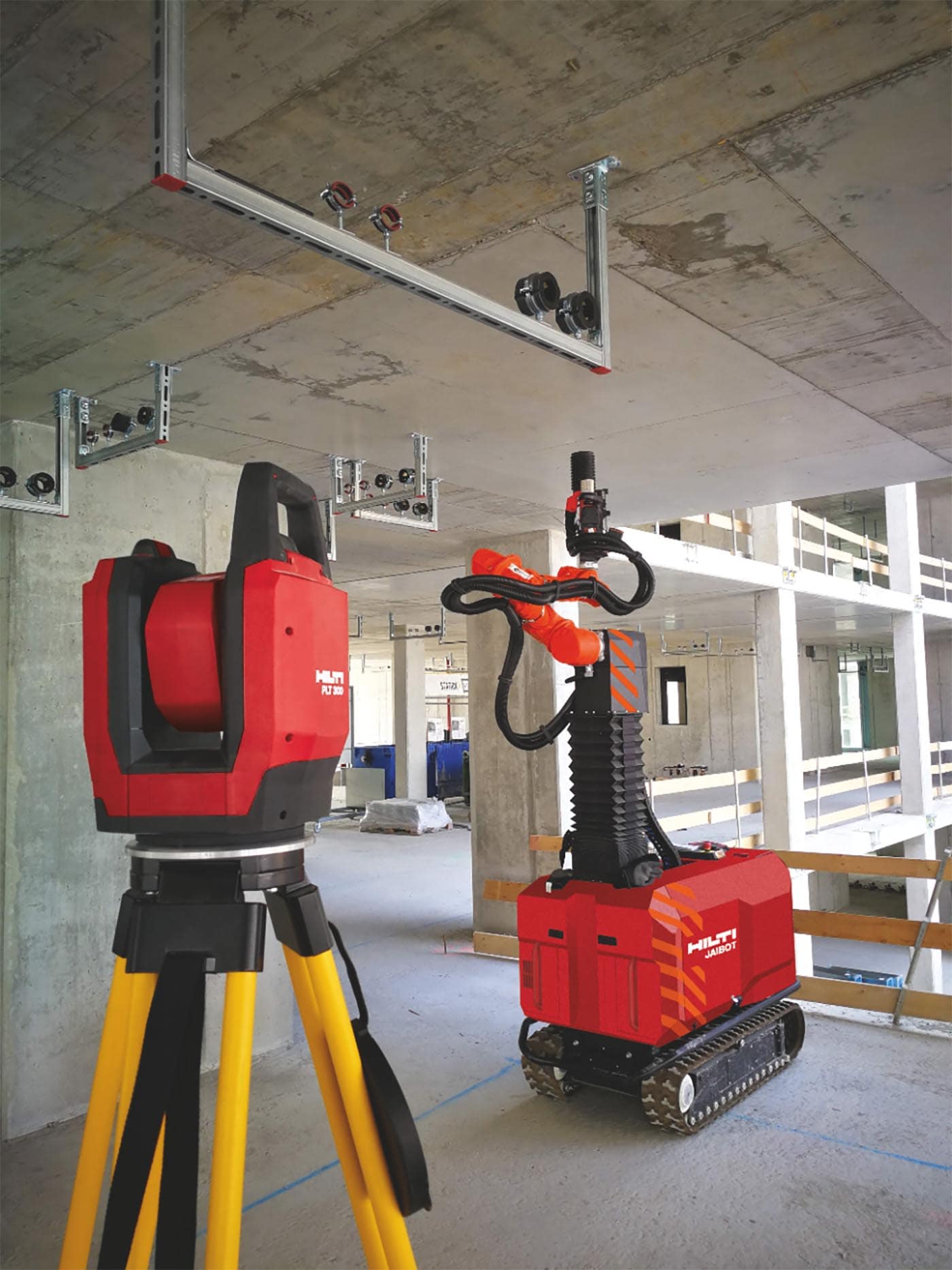 MEP installation system, total station and drilling robot on a construction site